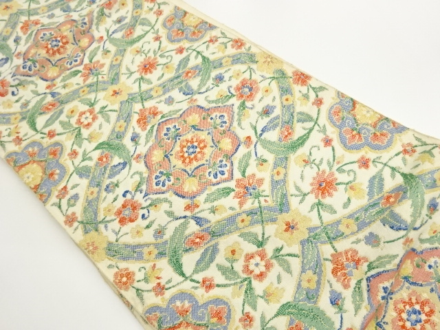 手織り紬変わり襷に華紋・草花模様織出し名古屋帯